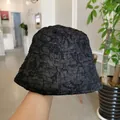 Women's black bucket hat with pleated texture for sun protection and casual wear - M / Black