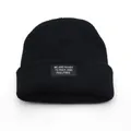 Fashionable black ribbed knit beanie with white lettered patch for winter warmth - Adjustable / Black