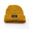 Mustard yellow ribbed knit beanie with motivational letter patch for winter warmth - Adjustable / Turmeric