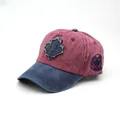 Vintage burgundy and navy cotton baseball cap featuring embroidered Canada maple leaf patch - Adjustable / Rust red