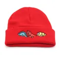 Detail of red knit beanie featuring colorful dinosaur embroidery on the folded cuff - Adjustable / Red