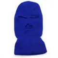 Detailed texture of dark blue three-hole knitted balaclava with vertical ribbed pattern - Blue