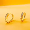 Elegant gold-plated geometric hoop earrings with micro-set zircons on yellow background - Round Vertical Inlaid Style