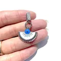 Macro detail of silver fan-shaped evil eye pendant with blue enamel and micro zircons - Small Fan (Silver 2) / Silver