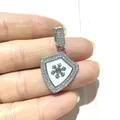 Detailed macro shot of silver shield pendant with inlaid zircon and metal snowflake - Silver White Shield Snowflake (12)