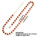 Macro detail of gold plated necklace with red heart-shaped zircon stones and lobster clasp - Red Gold Base (No.4)