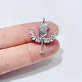 Sparkling silver winged heart arrow pendant with baguette zircons held on fingertips - Heart Wing Arrow Style / Silver
