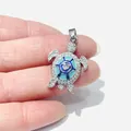 Detailed view of silver turtle pendant featuring blue enamel and heart-shaped zircon - Silver Turtle (Blue Enamel Heart)