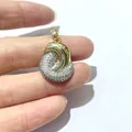 Two-tone gold plated pendant with cubic zirconia inlay shown on a white background - Streamlined Embrace Style