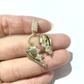 Macro shot of gold broken heart pendant with micro-paved cubic zirconia stones - Spliced Broken Heart Style / Gold No.3