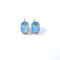 Elegant gold leverback earrings featuring rectangular light blue cubic zirconia crystals - Light Blue