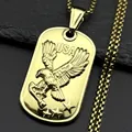 Gold eagle military tag necklace with USA relief and box chain on stone background - Gold
