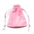 Macro view of a soft pink velvet drawstring jewelry pouch with satin ribbons for gifts - Pink Velvet Pouch