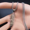 Detailed close-up of a silver stainless steel feather pendant on a sturdy box chain - Silver
