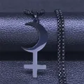Macro shot of gothic black moon crescent and cross pendant on stainless steel ball chain - Black