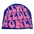 Detailed knit texture of navy blue beanie with pink All She Needs Is Money lettering - Dark Blue and Pink (Model 4) / Dark Blue Bottom Pink Text-ALL SHE NEEDS IS MONEY