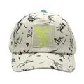 Détail d'une casquette de baseball beige pour enfants avec imprimés de dinosaures - Réglable / Blanc Cassé