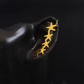 Elegant gold starfish ear crawler featuring five stars along the ear lobe on black background - Left Ear / Gold Left Ear