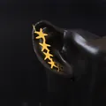 Close-up of golden starfish ear crawler earrings on a professional black model display - Right Ear / Gold Right Ear