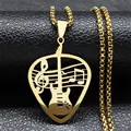 Detailed macro of gold musical guitar pick pendant with notes on black leather - Long / Gold