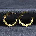 Elegant gold daisy flower curved hoop earrings for women featuring minimalist floral design - Gold