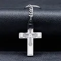 Detailed macro shot of a stainless steel cross keychain with engraved geometric patterns - Silver