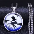 Stainless steel necklace with moon, broom, and cat pendant on black leather background - Silver