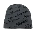 Close-up of the grey knitted beanie with repeating black Nerest jacquard letter patterns - Gray