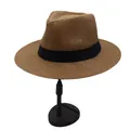 Detail of a brown woven straw fedora hat with a black grosgrain ribbon on a display stand - Coffee