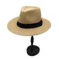 Close-up of khaki straw Panama hat featuring fine mesh texture and a black ribbon band - Camel