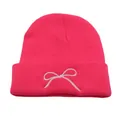 Pink knitted beanie with white bow embroidery and cuffed edge for winter outdoor warmth - One Size / Rose Red