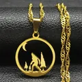 Macro shot of gold stainless steel pendant featuring Bigfoot, forest, and moon silhouette - Sasquatch Forest Style / Gold