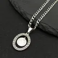 Macro shot of silver Cuban chain with Saint Benedict medal pendant and diamond frame - Silver 60cm