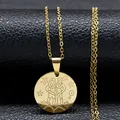 Golden Gemini zodiac necklace with stainless steel pendant on a black texture surface - Gold Gemini