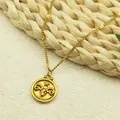 Gold Aries zodiac pendant necklace with embossed ram design on a fine metal chain link - Aries