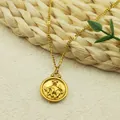 Golden Taurus zodiac necklace featuring a circular embossed relief pendant on chain - Taurus
