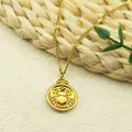 Gold Cancer zodiac pendant necklace with embossed crab design on a fine chain - Cancer