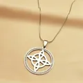 Detail of silver-tone witch knot pendant with shimmering crystals on silk background - Silver