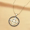 Detailed close-up of a silver witch knot pendant with black crystal halo on satin - Silver/Black Zirconia