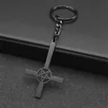 Detail of gothic black metal inverted cross keychain with pentagram and matte finish - Black