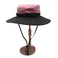 Detail view of the pink and black color-block sun hat with textured ripstop fabric and chin strap - M / Pink