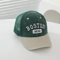 Detailed embroidery of BOSTON and 1630 on a green and beige mesh trucker cap - Adjustable / Green