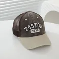 Close-up of vintage Boston kids trucker hat with 3D embroidery and breathable mesh back - Adjustable / Coffee