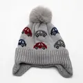 Detail of grey knitted kids hat with car jacquard patterns and fluffy pompom - One Size Elastic (3-10 Years) / Gray