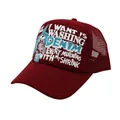 Detail of burgundy trucker hat with breathable mesh and white 3D printed lettering - Red