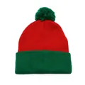 Close-up of the red and green knit texture and soft pom-pom on the festive beanie hat - Green Red Style
