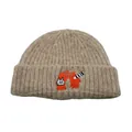 Detailed view of the cute cat embroidery and COOL text on the beige knitted beanie - One Size / Khaki