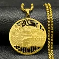 Macro shot of gold stainless steel Jerusalem skyline pendant with Hebrew engraving - Gold