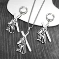 Close-up of stainless steel cross necklace and earrings set with religious pendant - Silver