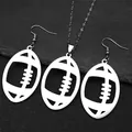 Detailed close-up of polished silver american football pendant and earrings set on stone - Necklace and Earring Set / Silver Jewelry Set